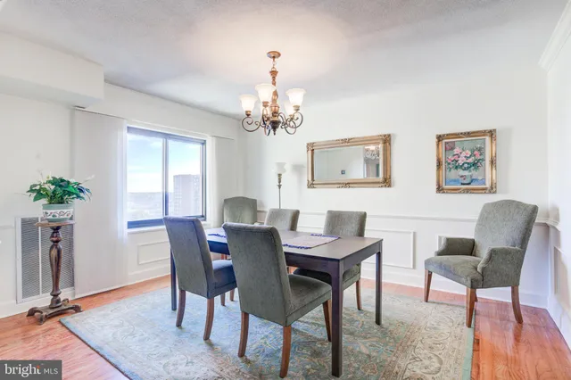 a view of a dining room with furniture and window