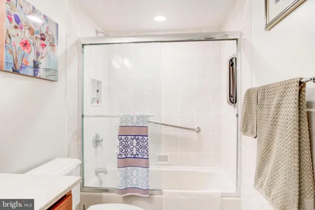 a bathroom with a shower and a toilet