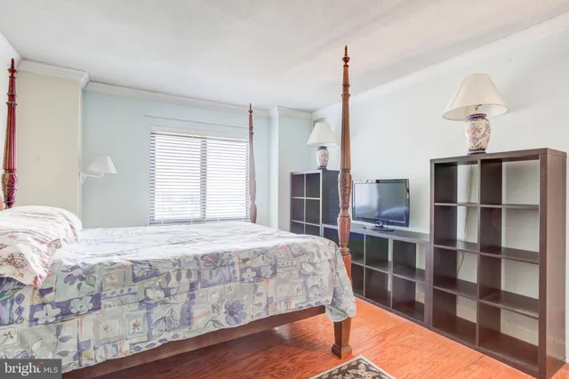 a bedroom with a bed and closet