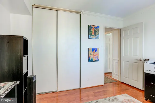 a view of an entryway with wooden floor
