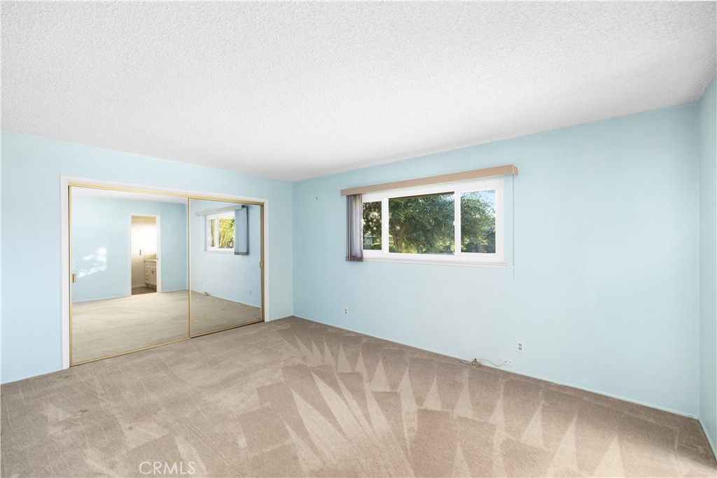 13402 Winthrope Street North Tustin, CA 92705 - Photo 21 of 34 a view of an empty room with window and wooden floor