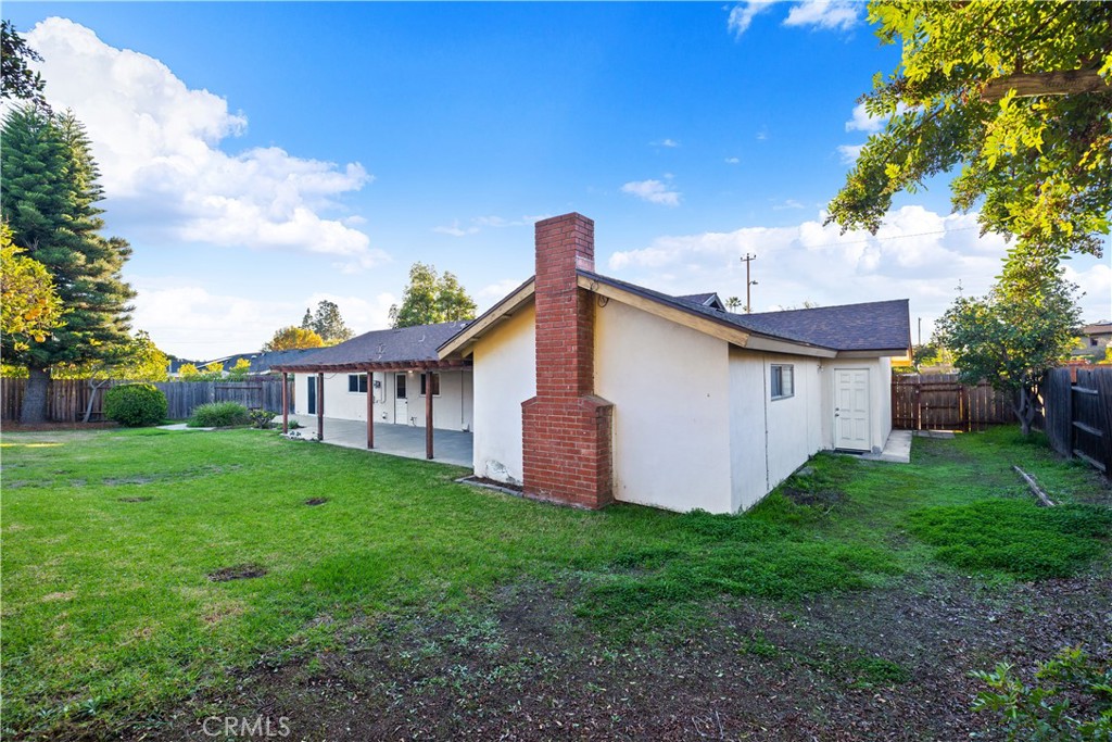 13402 Winthrope Street North Tustin, CA 92705 - Photo 28 of 34 a view of a house with yard and a tree