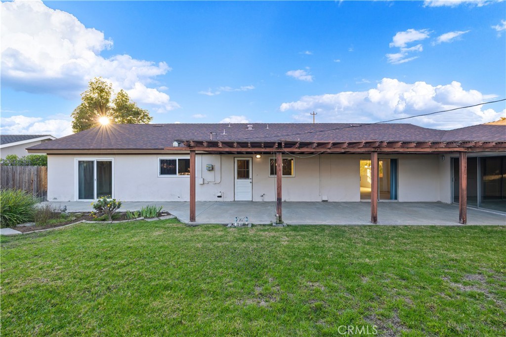 13402 Winthrope Street North Tustin, CA 92705 - Photo 30 of 34 a front view of a house with a garden and yard
