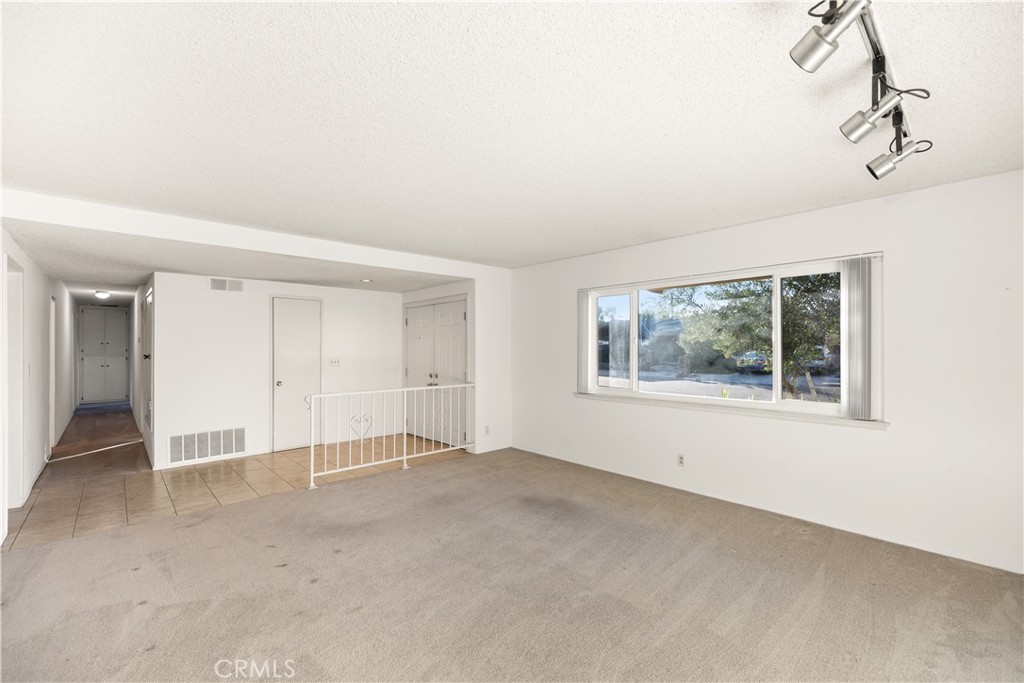 13402 Winthrope Street North Tustin, CA 92705 - Photo 6 of 34 an empty room with a empty space and windows