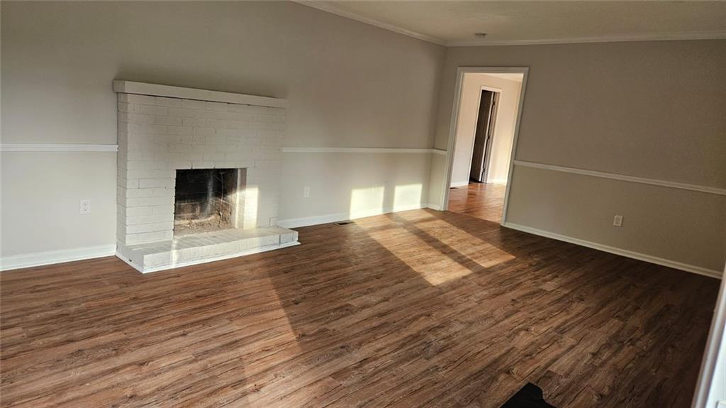 471 Perkins Circle Canton, GA 30115 - Photo 15 of 20 a view of empty room with wooden floor and fireplace