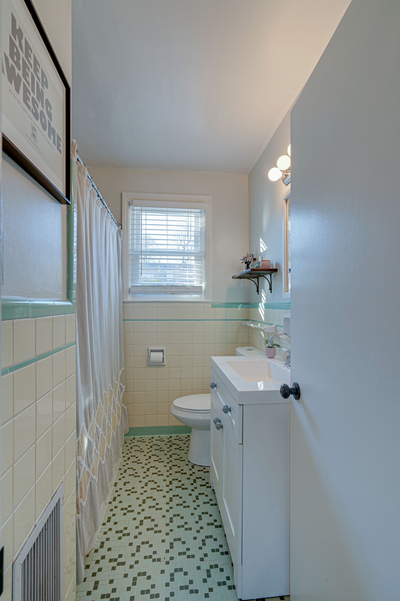 919 Mitchell Road Nashville, TN 37206 - Photo 13 of 26 a bathroom with a sink a toilet a window and vanity