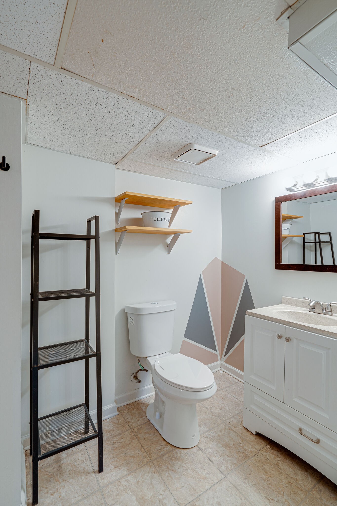 919 Mitchell Road Nashville, TN 37206 - Photo 21 of 26 a white toilet sitting next to a bathroom sink