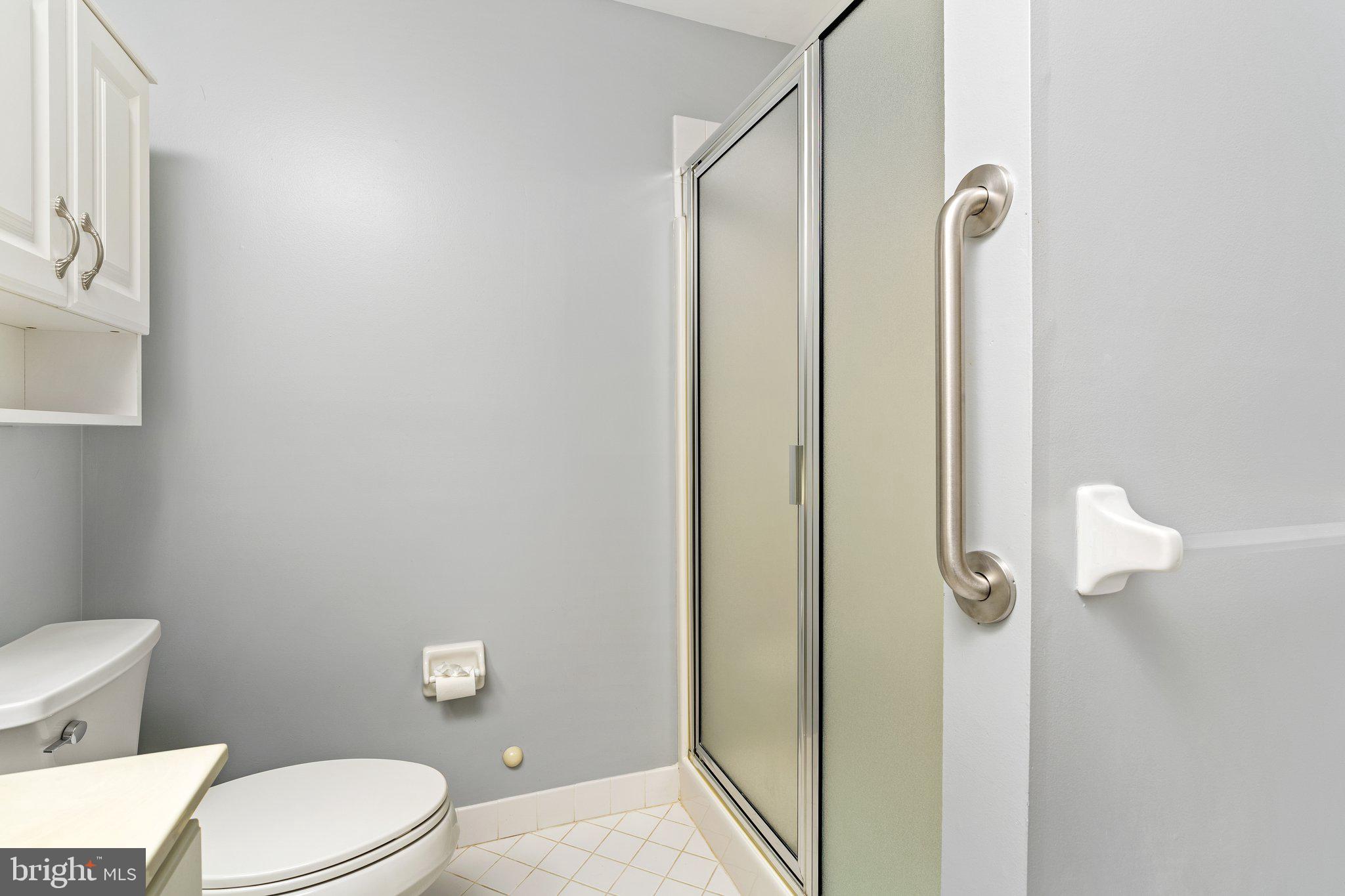 26 Brecht Road Hamilton, NJ 08690 - Photo 17 of 25 a white toilet sitting next to a bathroom sink