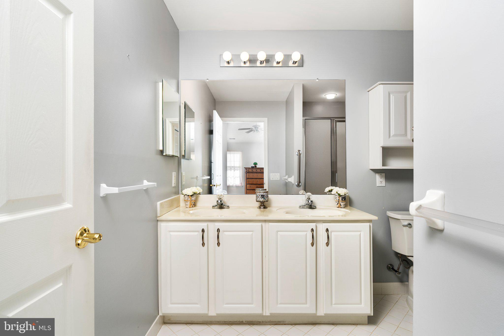 26 Brecht Road Hamilton, NJ 08690 - Photo 18 of 25 a bathroom with a sink and a mirror