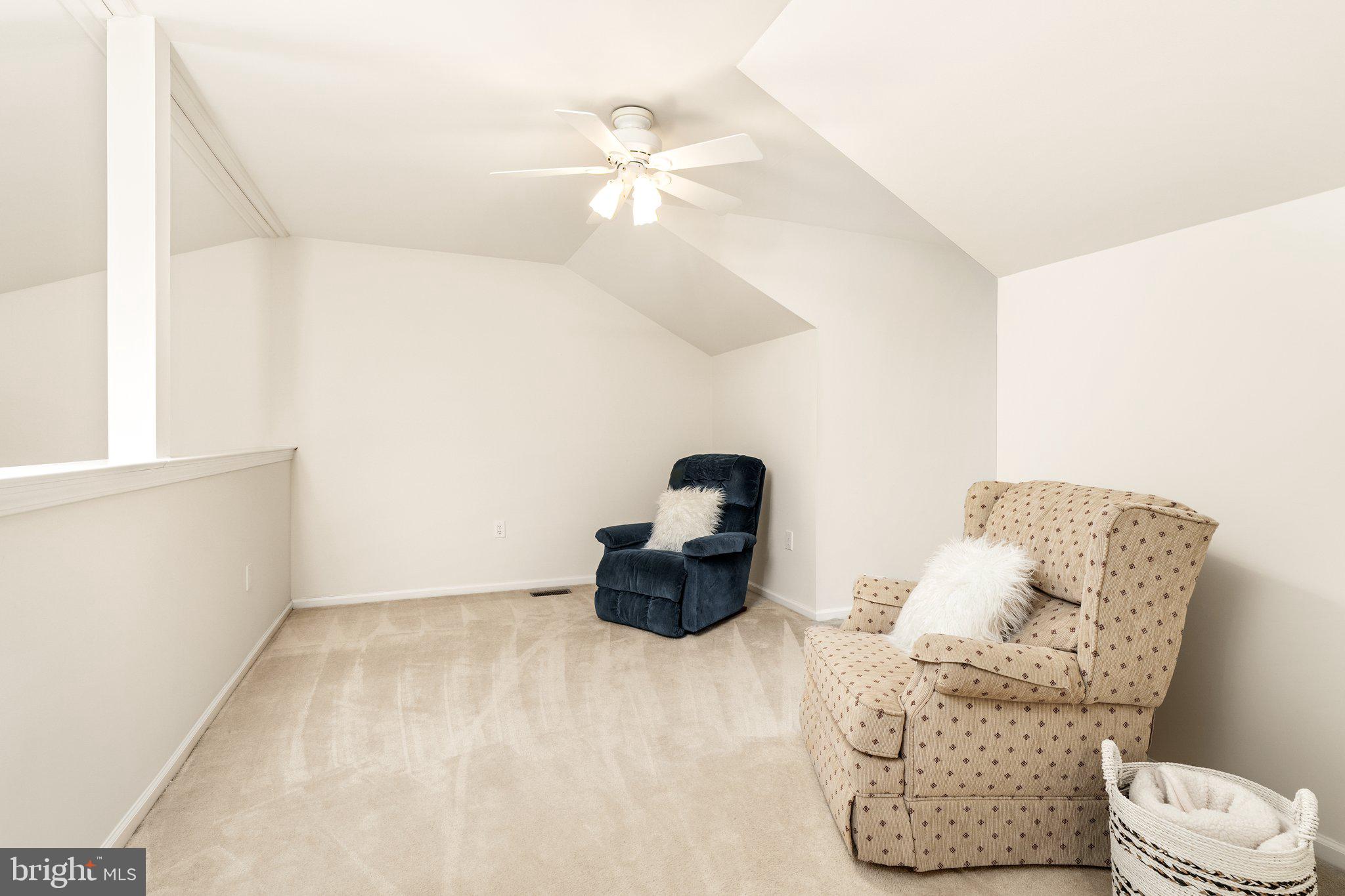 26 Brecht Road Hamilton, NJ 08690 - Photo 19 of 25 a living room with furniture and a chandelier