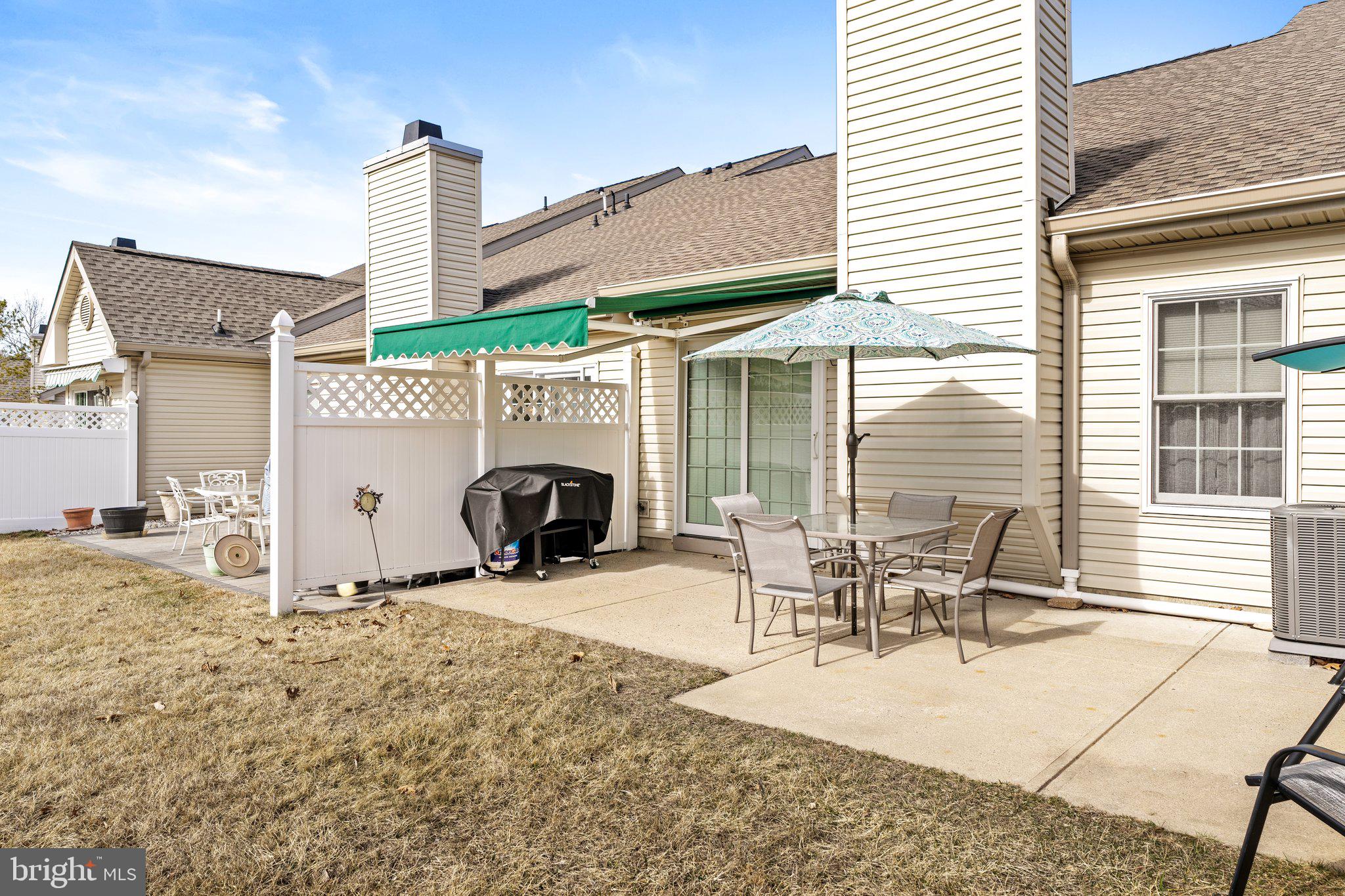 26 Brecht Road Hamilton, NJ 08690 - Photo 23 of 25 a view of a patio with table and chairs and barbeque grill with a small yard