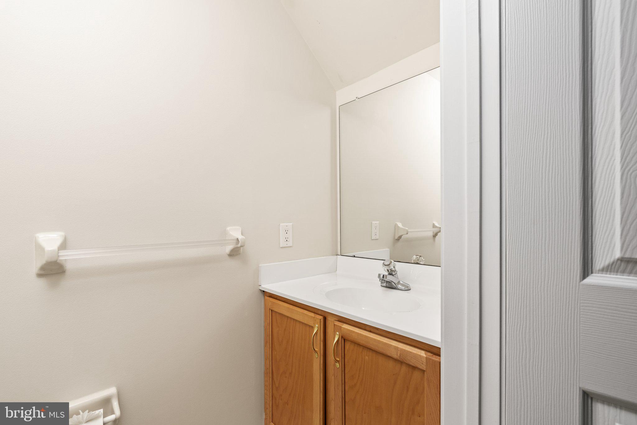 26 Brecht Road Hamilton, NJ 08690 - Photo 8 of 25 a bathroom with a sink and a mirror