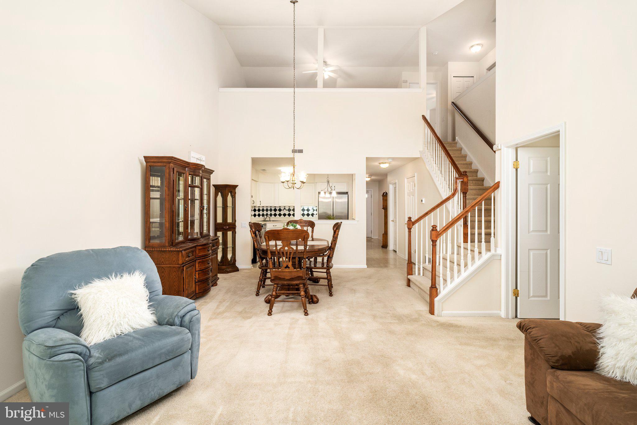 26 Brecht Road Hamilton, NJ 08690 - Photo 10 of 25 a living room with furniture and a chandelier