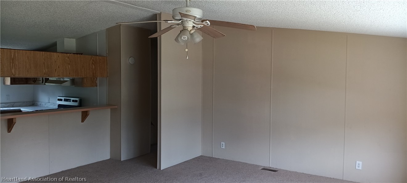 1026 Cardinal Road Wauchula, FL 33873 - Photo 5 of 12 a kitchen with stainless steel appliances a refrigerator and a sink