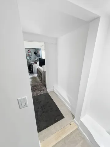 a view of a living room with furniture and a rug