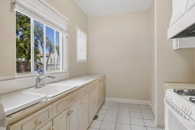 a bathroom with a sink and a window