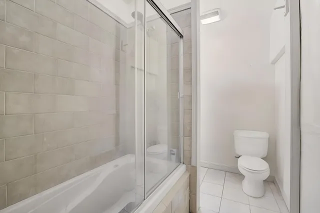 a bathroom with a toilet and a bathtub