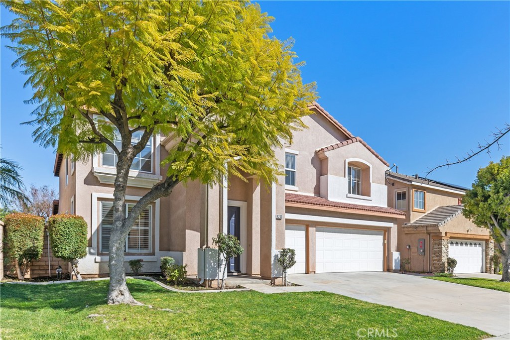 front view of a house with a yard