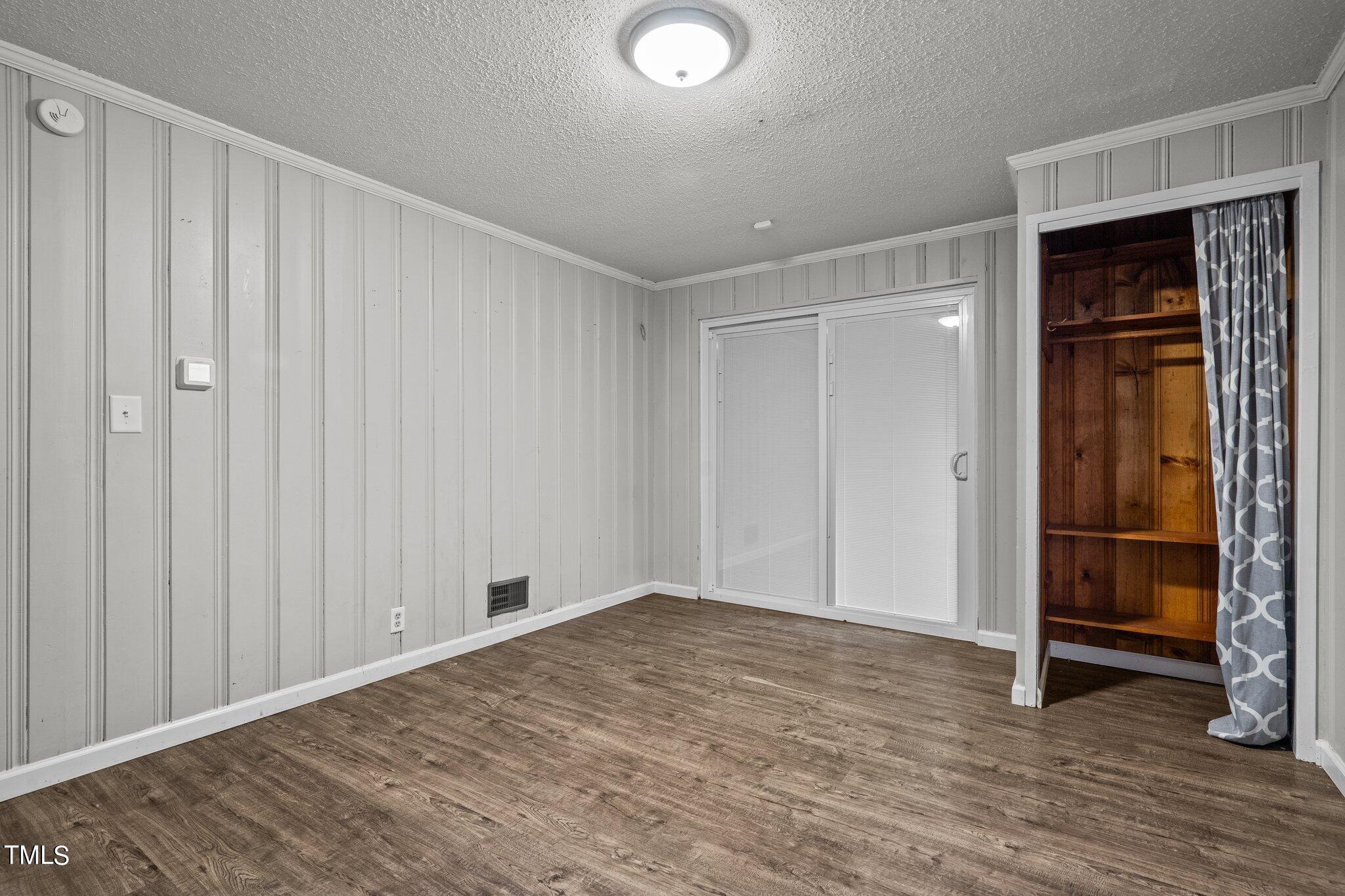 3500 Baugh Street Raleigh, NC 27604 - Photo 26 of 34 a view of a livingroom with wooden floor and closet