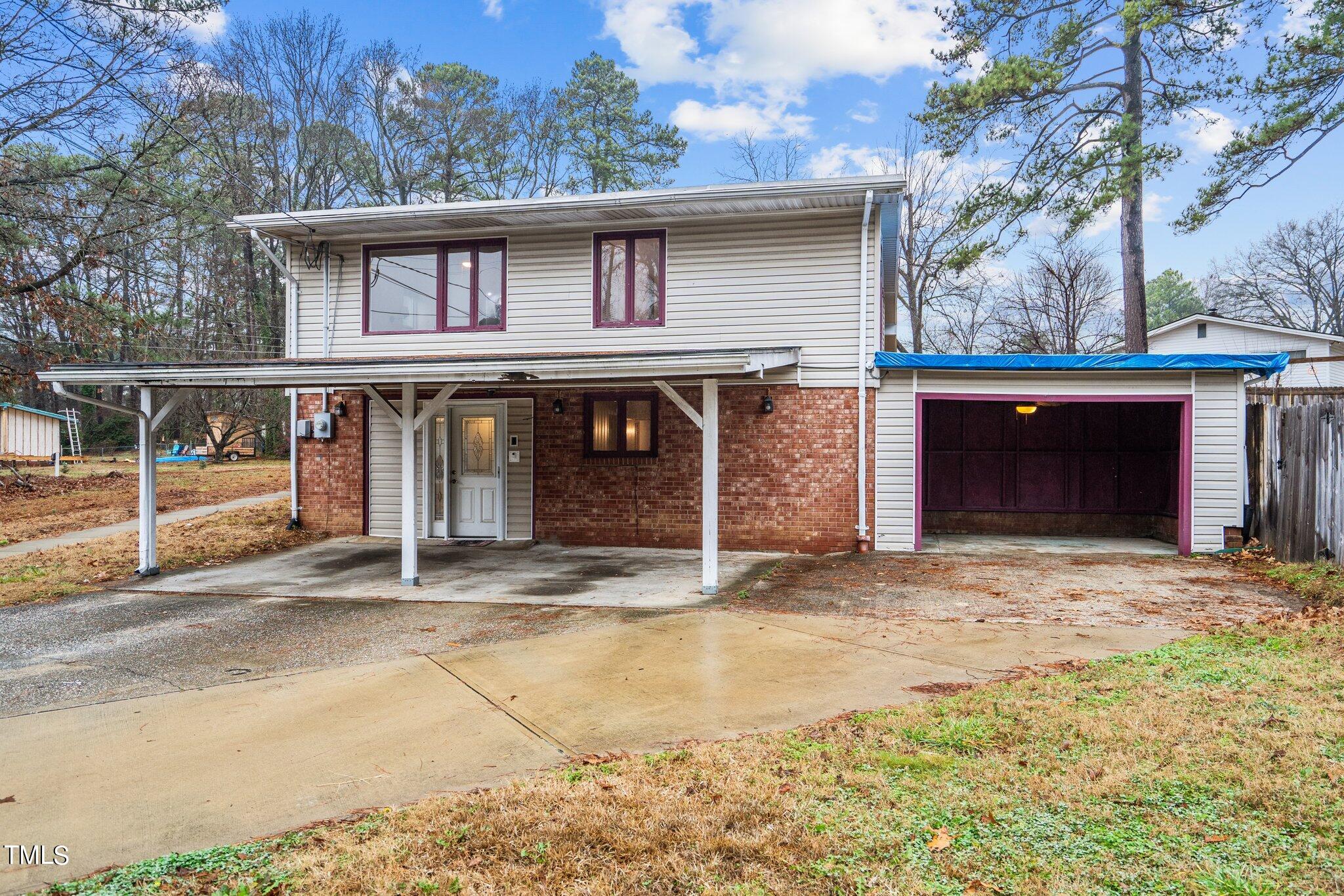 3500 Baugh Street Raleigh, NC 27604 - Photo 31 of 34 a front view of a house with a yard and garage
