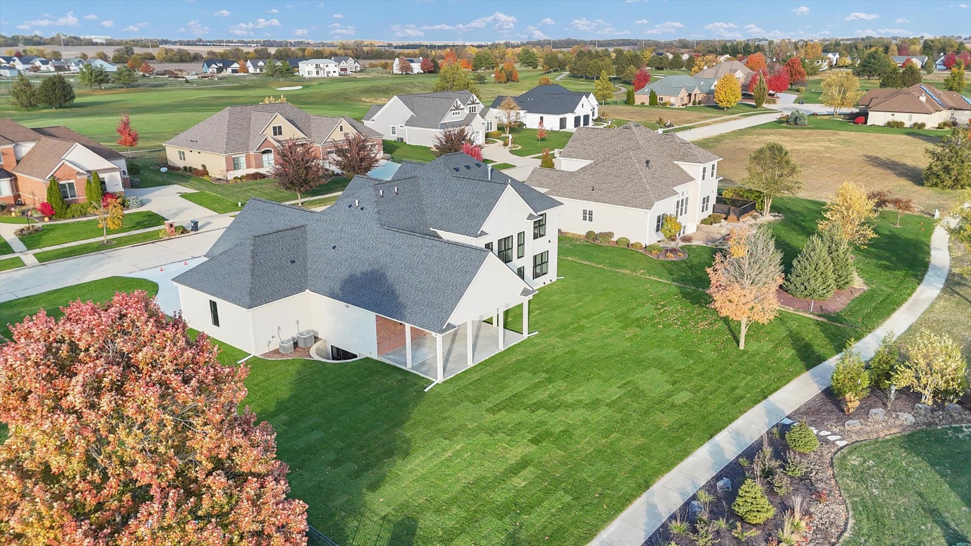 2709 East Castlerock Drive Urbana, IL 61802 - Photo 103 of 117 an aerial view of a house with a garden and lake view