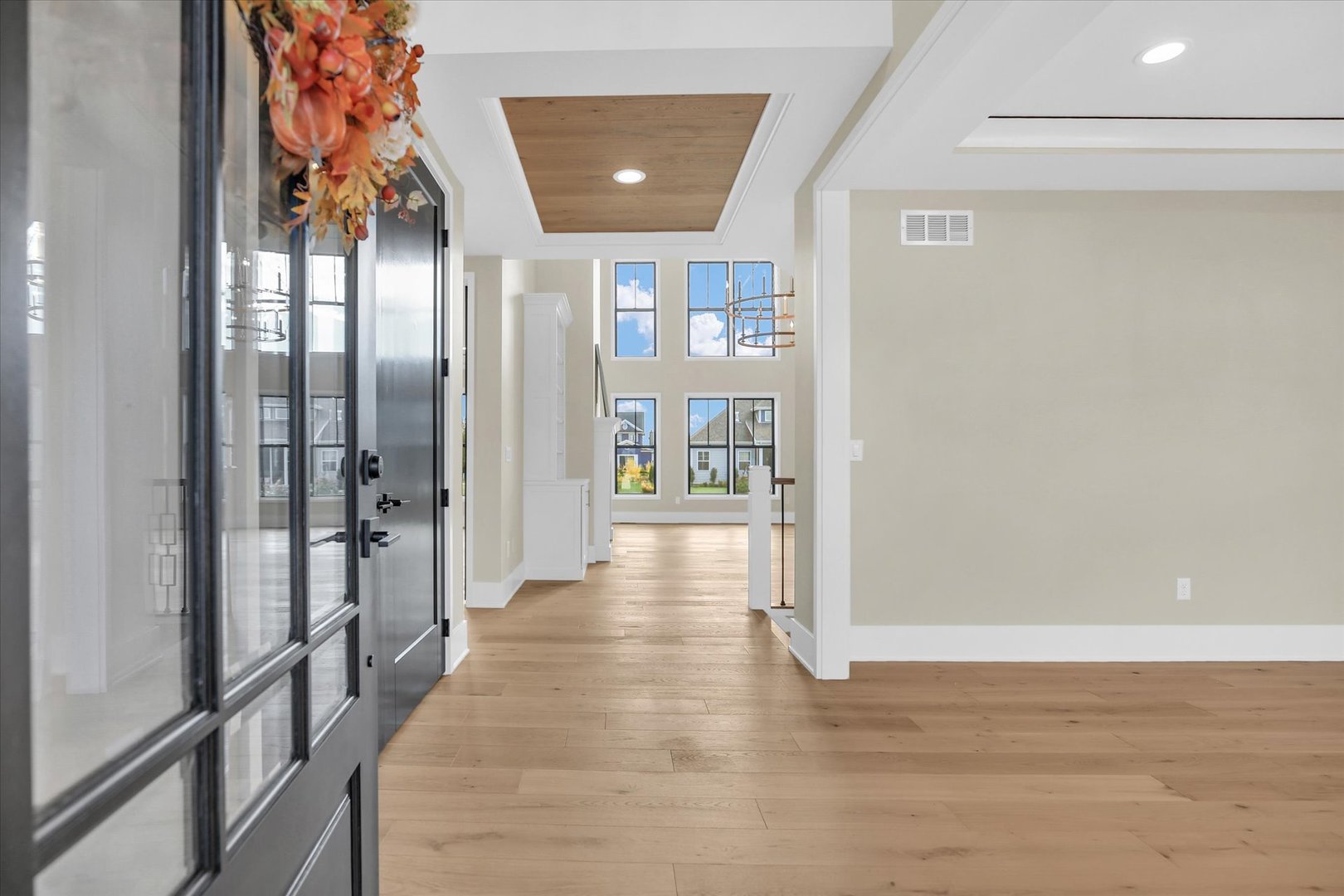 2709 East Castlerock Drive Urbana, IL 61802 - Photo 17 of 117 a view of a hallway with wooden floor and a living room