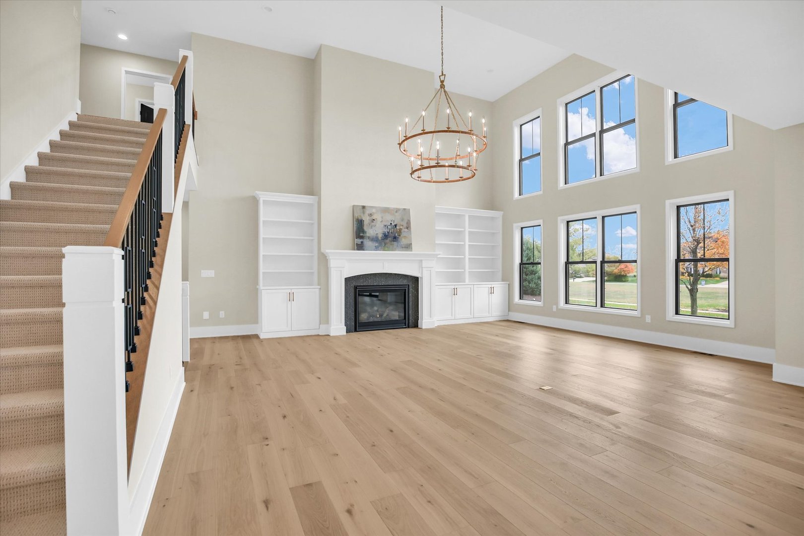 2709 East Castlerock Drive Urbana, IL 61802 - Photo 24 of 117 a view of an empty room with wooden floor fireplace and a window