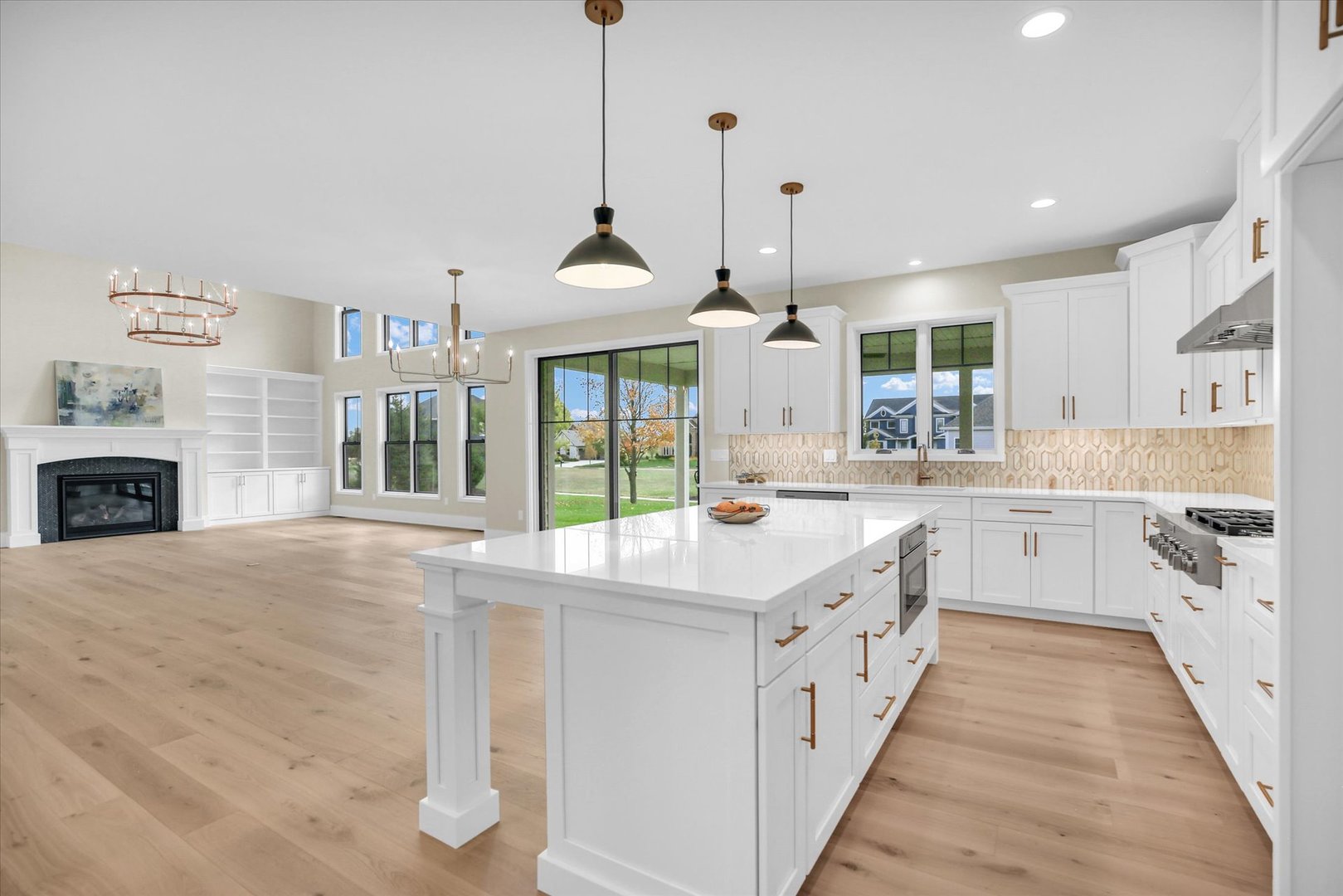 2709 East Castlerock Drive Urbana, IL 61802 - Photo 39 of 117 a large white kitchen with a sink and dishwasher with wooden floor
