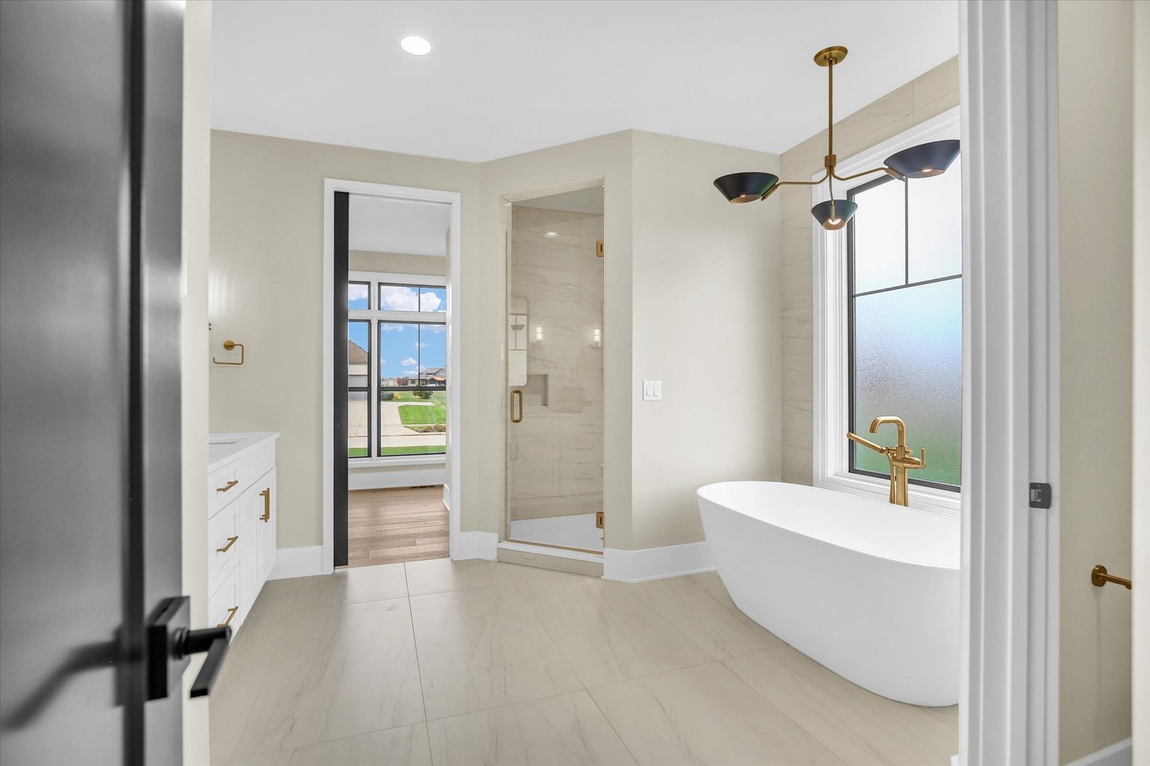 2709 East Castlerock Drive Urbana, IL 61802 - Photo 51 of 117 a bathroom with a tub shower and sink