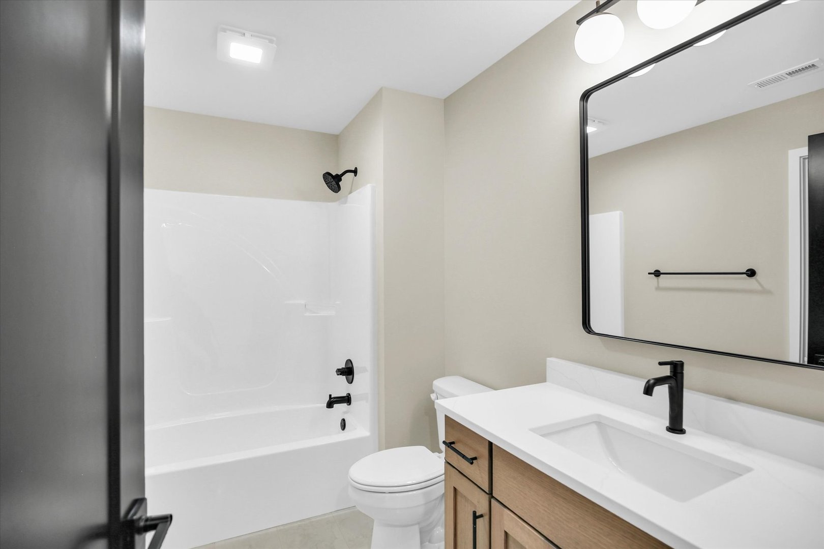 2709 East Castlerock Drive Urbana, IL 61802 - Photo 71 of 117 a bathroom with a sink a toilet and a large mirror
