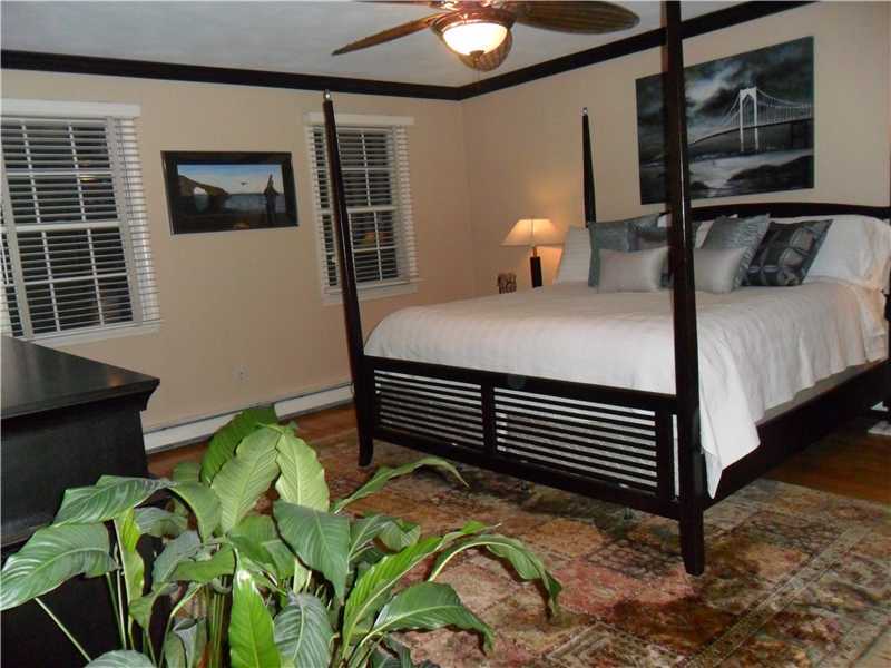 2 King Phillip Road Lincoln, RI 02865 - Photo 13 of 20 Master Bedroom. LARGE MASTER BED FEATURES PRIVATE BATH WITH JACUZZI TUB, PRIVATE SHOWER AND TWO CLOSETS.