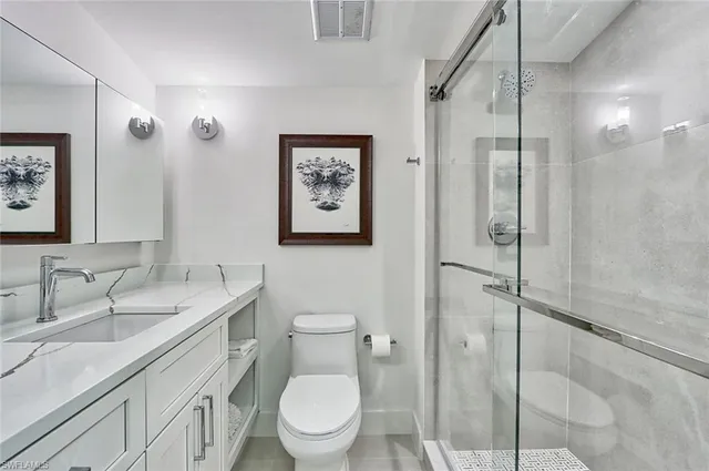 a bathroom with a toilet sink and shower