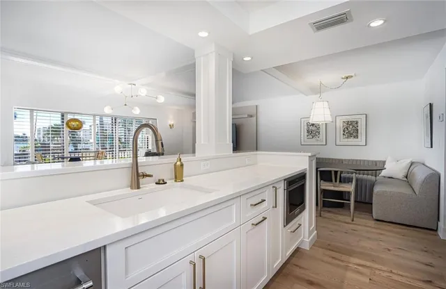 a spacious bathroom with a double vanity sink and a mirror