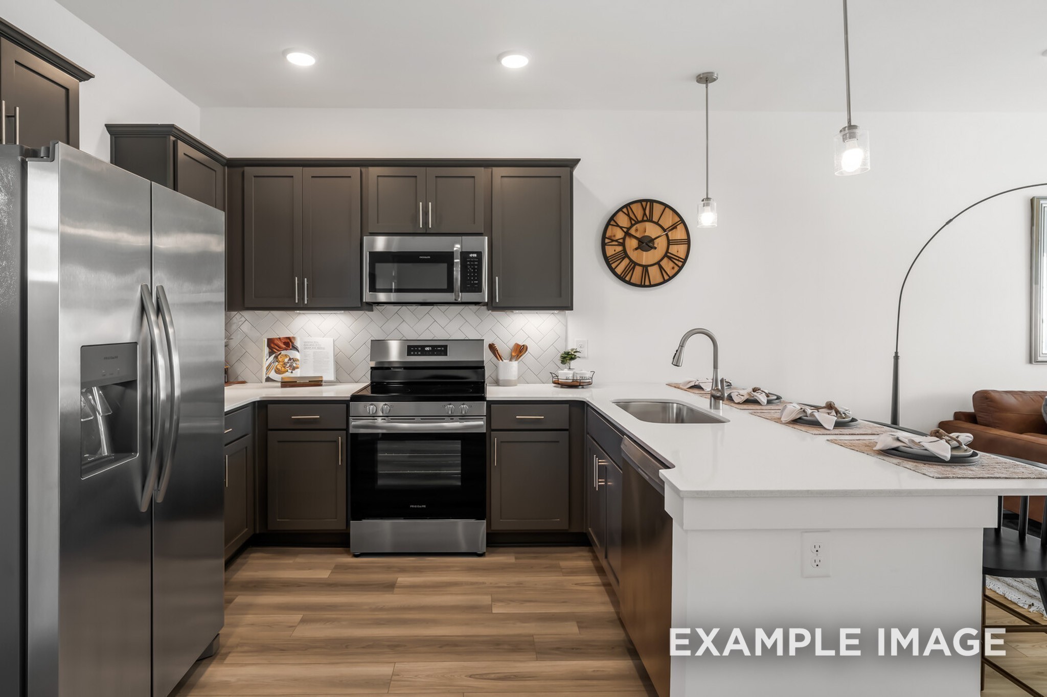 1733 Elliott Williams Way Gallatin, TN 37066 - Photo 13 of 23 a kitchen with stainless steel appliances granite countertop a sink a stove and refrigerator