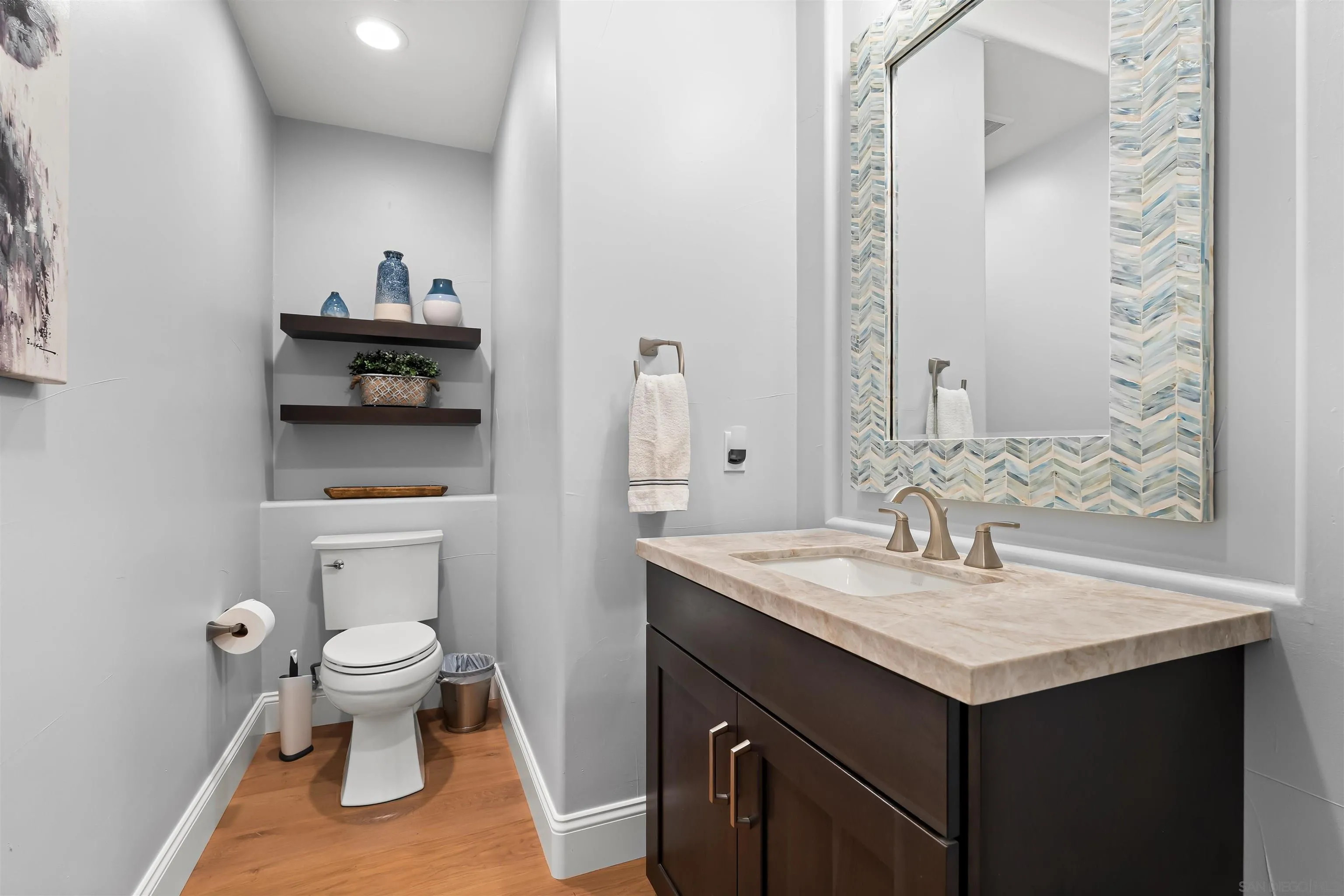 301 Cantle Lane Encinitas, CA 92024 - Photo 22 of 75 a bathroom with a sink and a toilet
