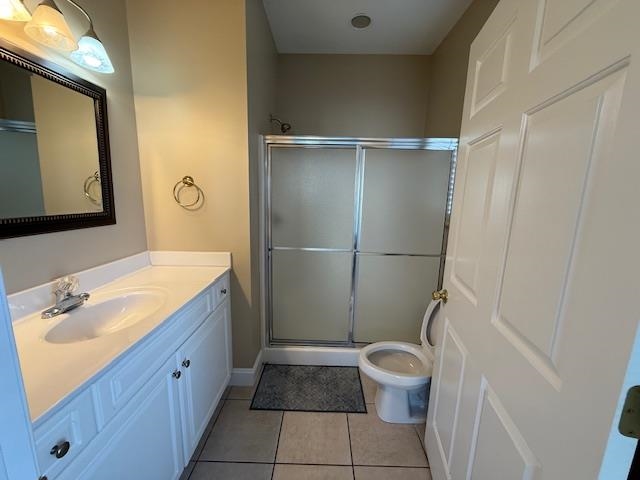 114 A 6th Avenue South Surfside Beach, SC 29575 - Photo 11 of 20 Full bath with light tile patterned flooring, vanity, and a stall shower