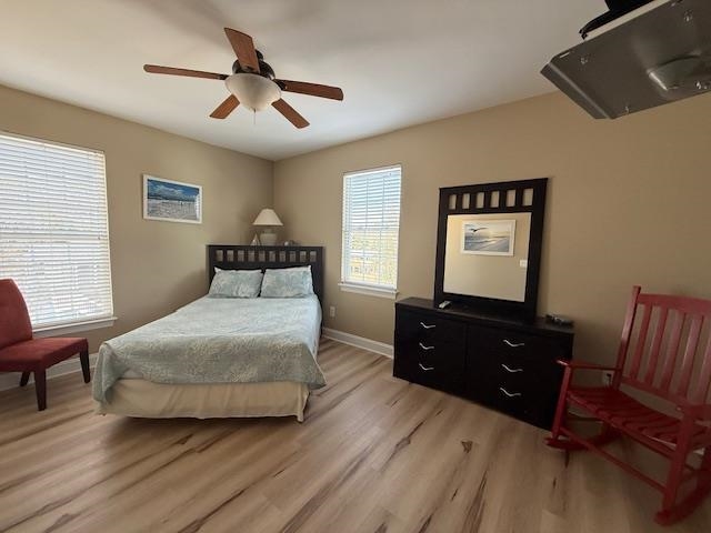 114 A 6th Avenue South Surfside Beach, SC 29575 - Photo 13 of 20 Bedroom featuring light wood finished floors and ceiling fan