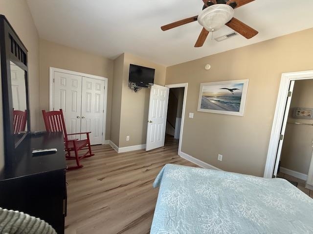 114 A 6th Avenue South Surfside Beach, SC 29575 - Photo 14 of 20 Bedroom with a closet, light wood-style floors, and a ceiling fan