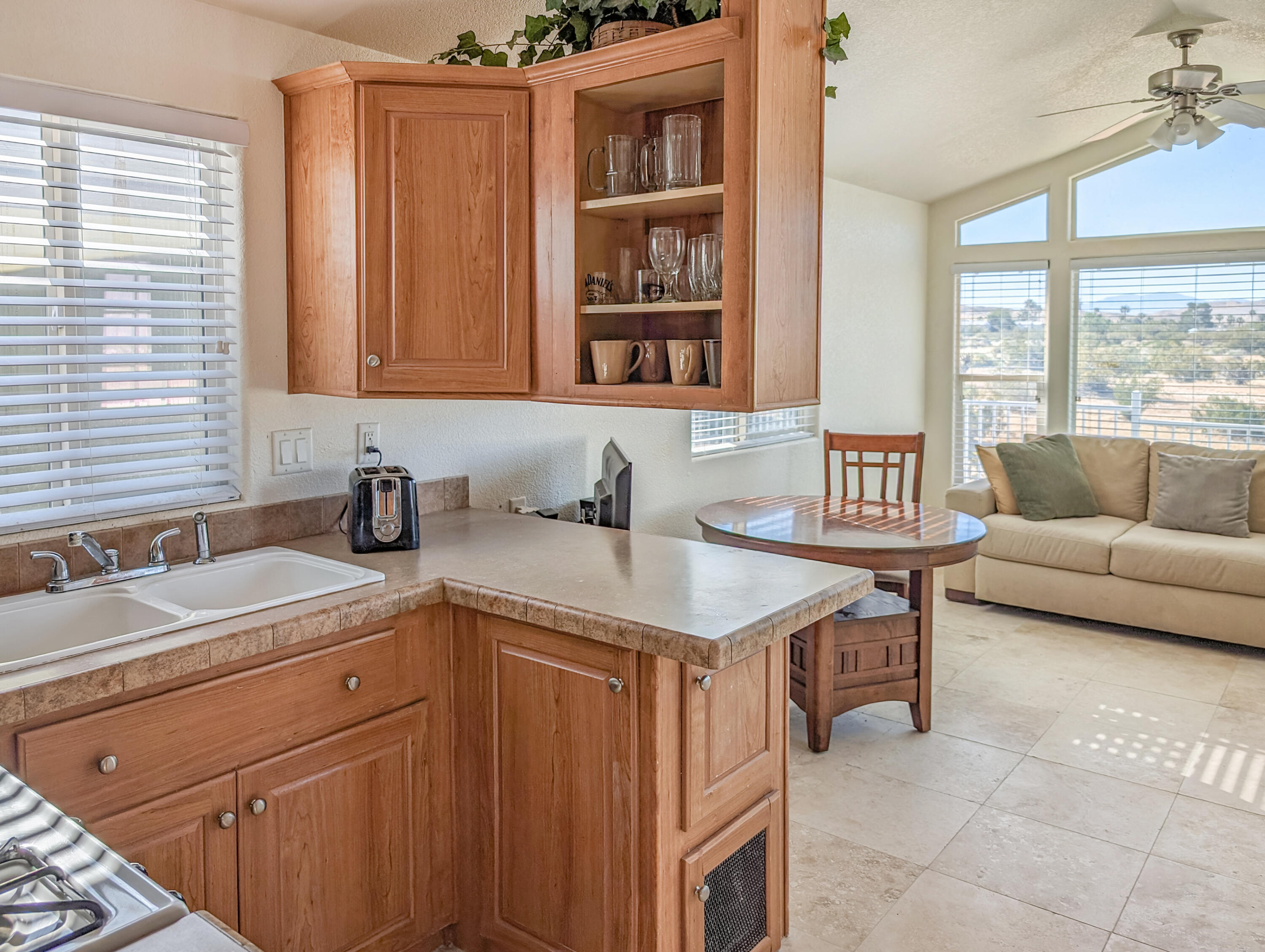 70200 Dillon Road, Unit 328 Desert Hot Springs, CA 92241 - Photo 14 of 25 a kitchen with a sink and a window