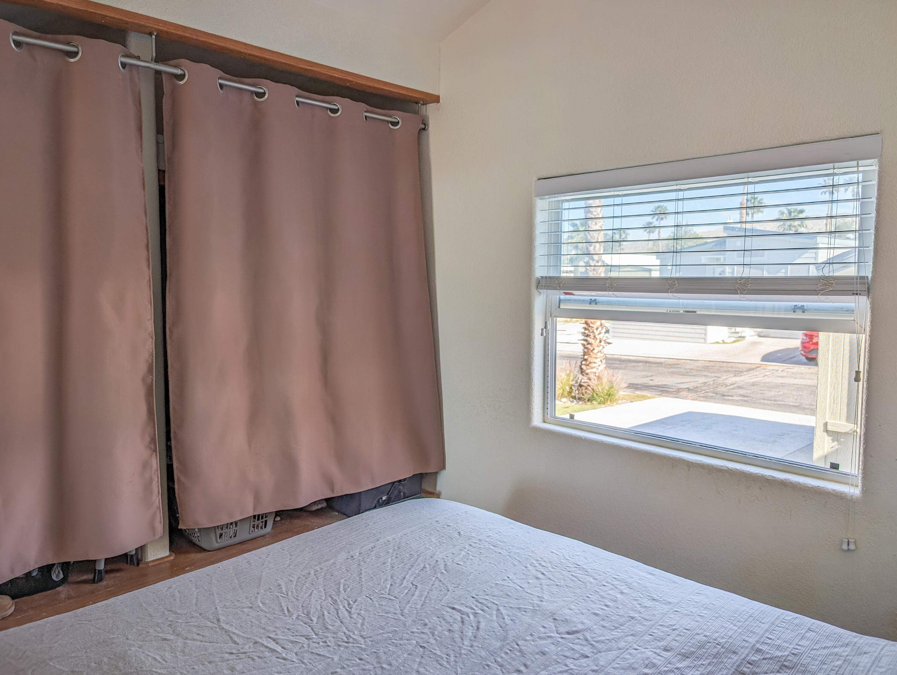 70200 Dillon Road, Unit 328 Desert Hot Springs, CA 92241 - Photo 19 of 25 a view of walk in closet with window