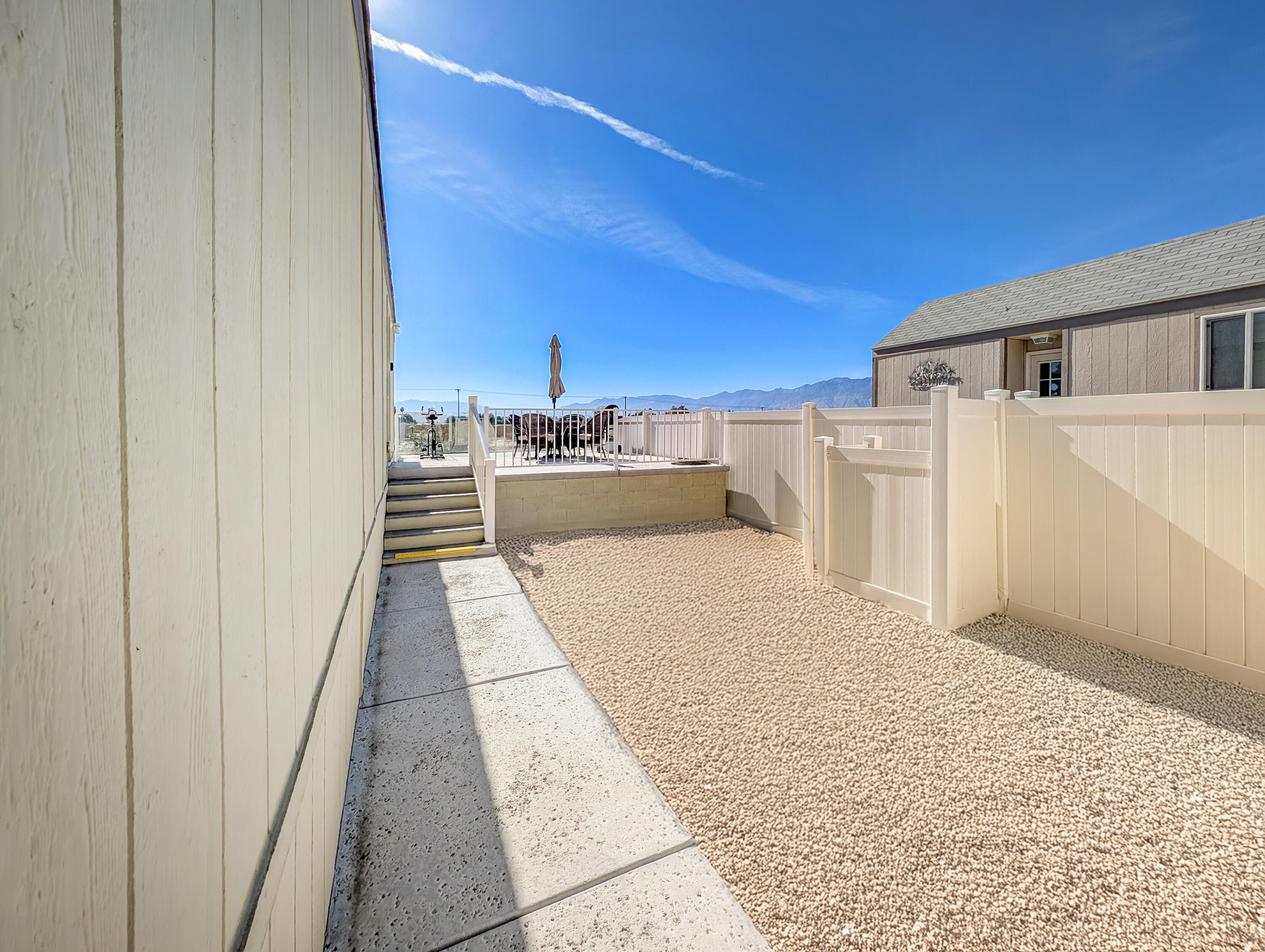 70200 Dillon Road, Unit 328 Desert Hot Springs, CA 92241 - Photo 6 of 25 a view of a balcony with white house