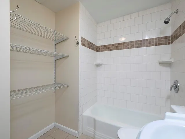 a bathroom with a shower and toilet