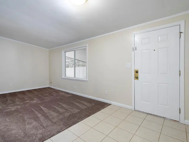 a view of an empty room and window