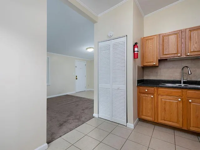 a kitchen with stainless steel appliances granite countertop a sink and cabinets