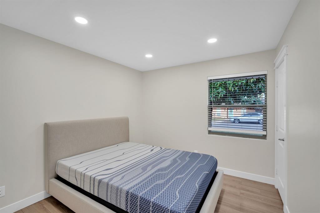 100 North Valley Street Red Oak, TX 75154 - Photo 13 of 31 a bedroom with a bed and a window