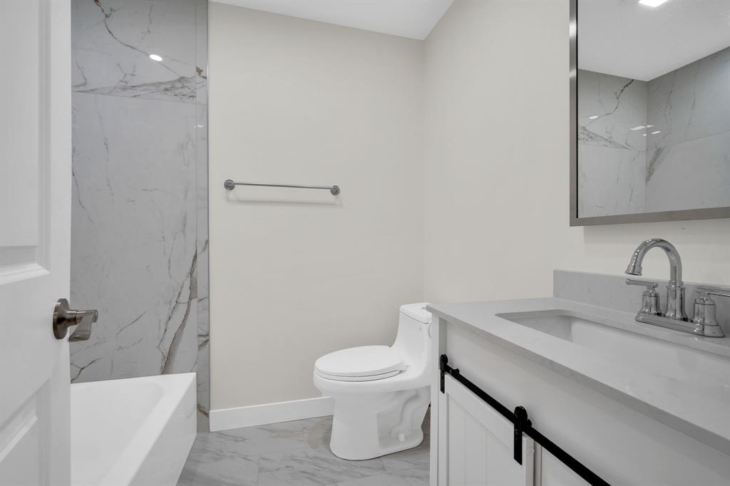 100 North Valley Street Red Oak, TX 75154 - Photo 14 of 31 a bathroom with a sink toilet and shower