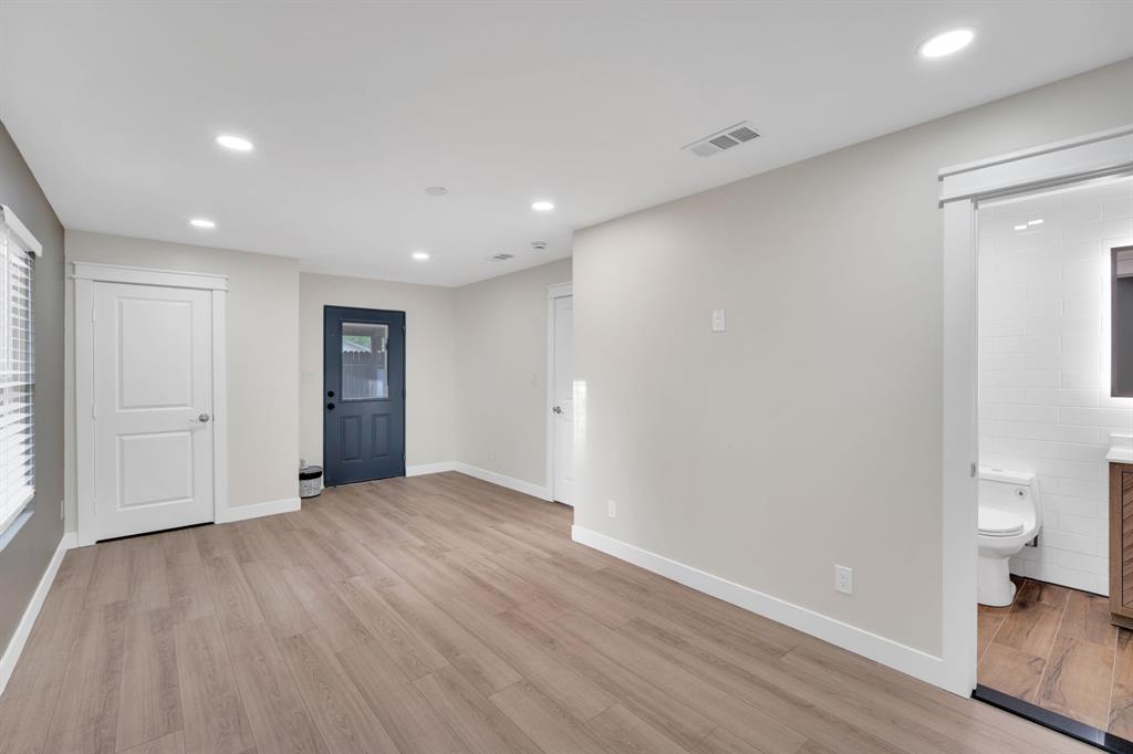 100 North Valley Street Red Oak, TX 75154 - Photo 15 of 31 a view of an empty room with wooden floor and a window