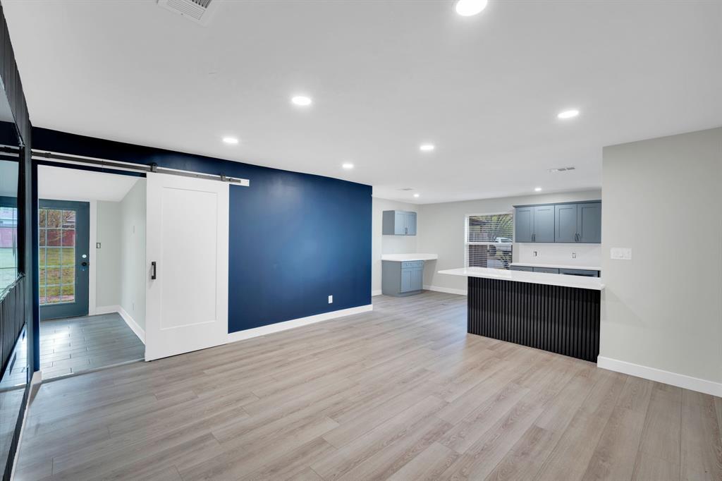 100 North Valley Street Red Oak, TX 75154 - Photo 3 of 31 a view of a kitchen with a sink and a refrigerator