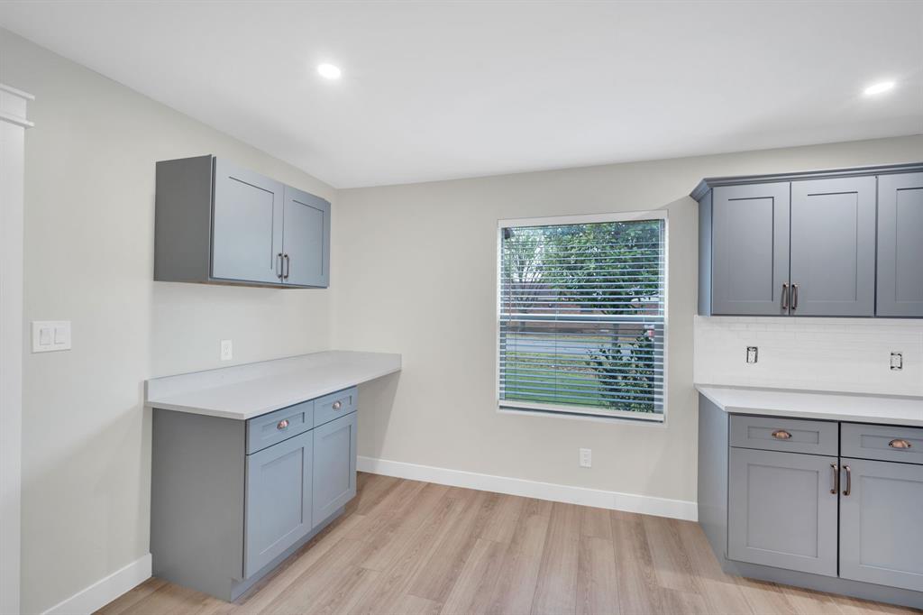 100 North Valley Street Red Oak, TX 75154 - Photo 7 of 31 a kitchen with a sink a window and cabinets