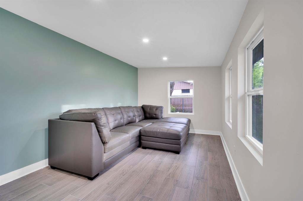 100 North Valley Street Red Oak, TX 75154 - Photo 8 of 31 a living room with furniture and a wooden floor